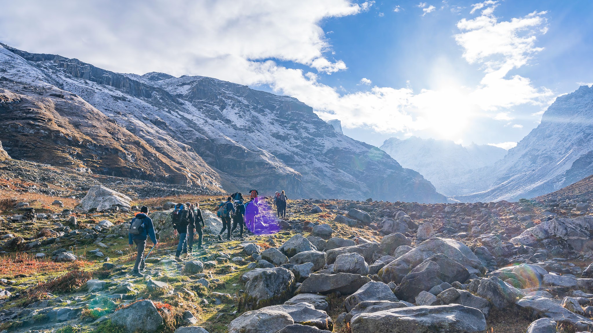 Trekkers crossing the Hampta Pass mountain trail
